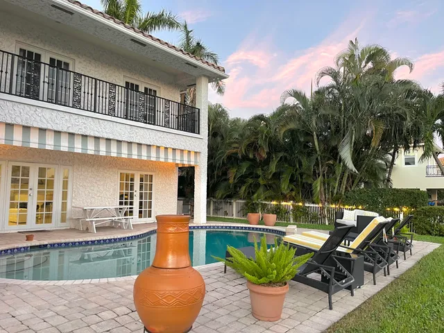 a view of a swimming pool with a lounge chairs