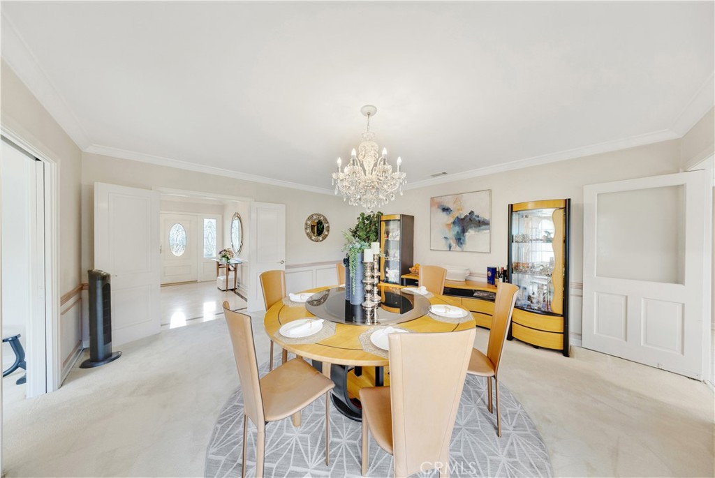 2835 Devonport Road San Marino, CA 91108 - Photo 14 of 54 a view of a dining room with furniture and chandelier