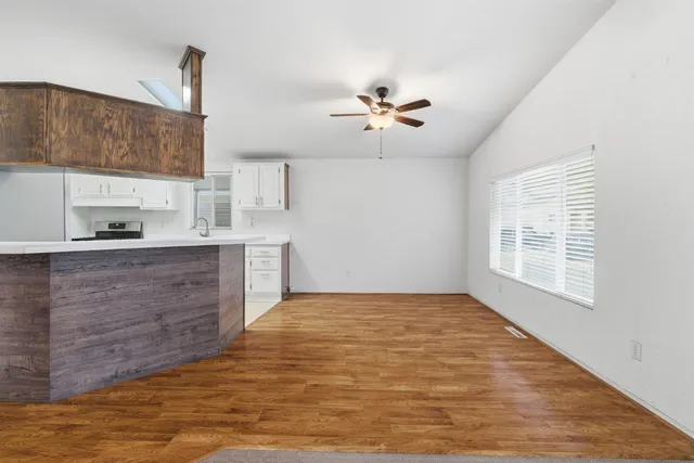 a view of a kitchen with microwave and cabinets