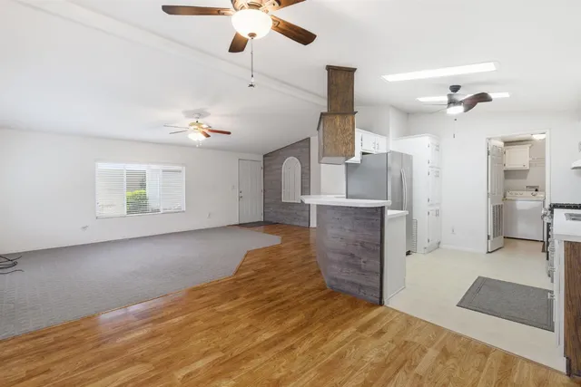 a view of livingroom with hardwood floor and a ceiling fan