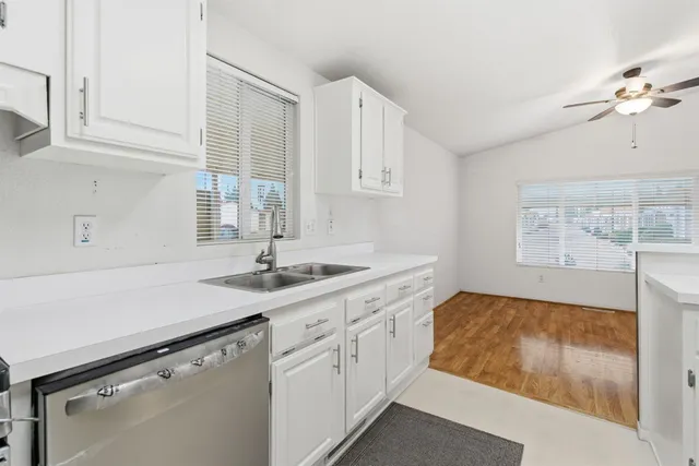 a kitchen with a sink and cabinets