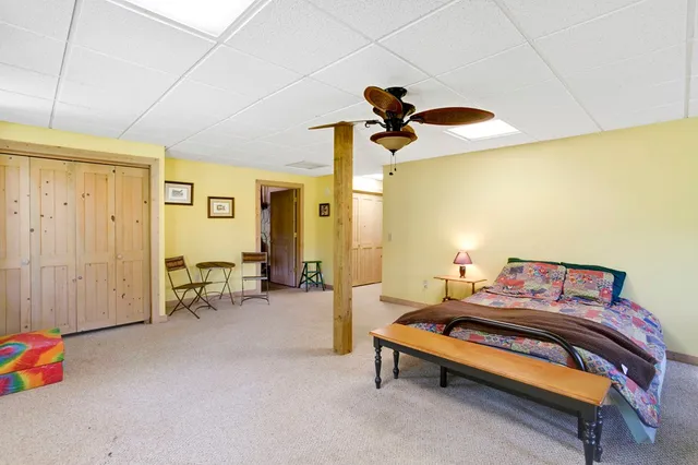 a bedroom with furniture and a window