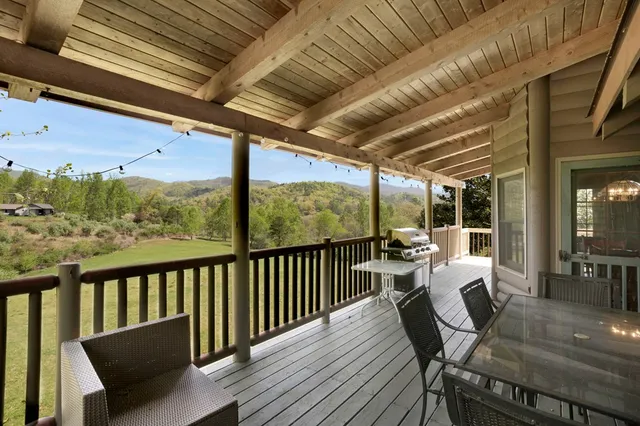 a view of a two chairs in the balcony