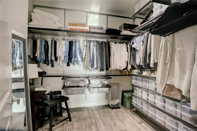a kitchen with a refrigerator and chairs