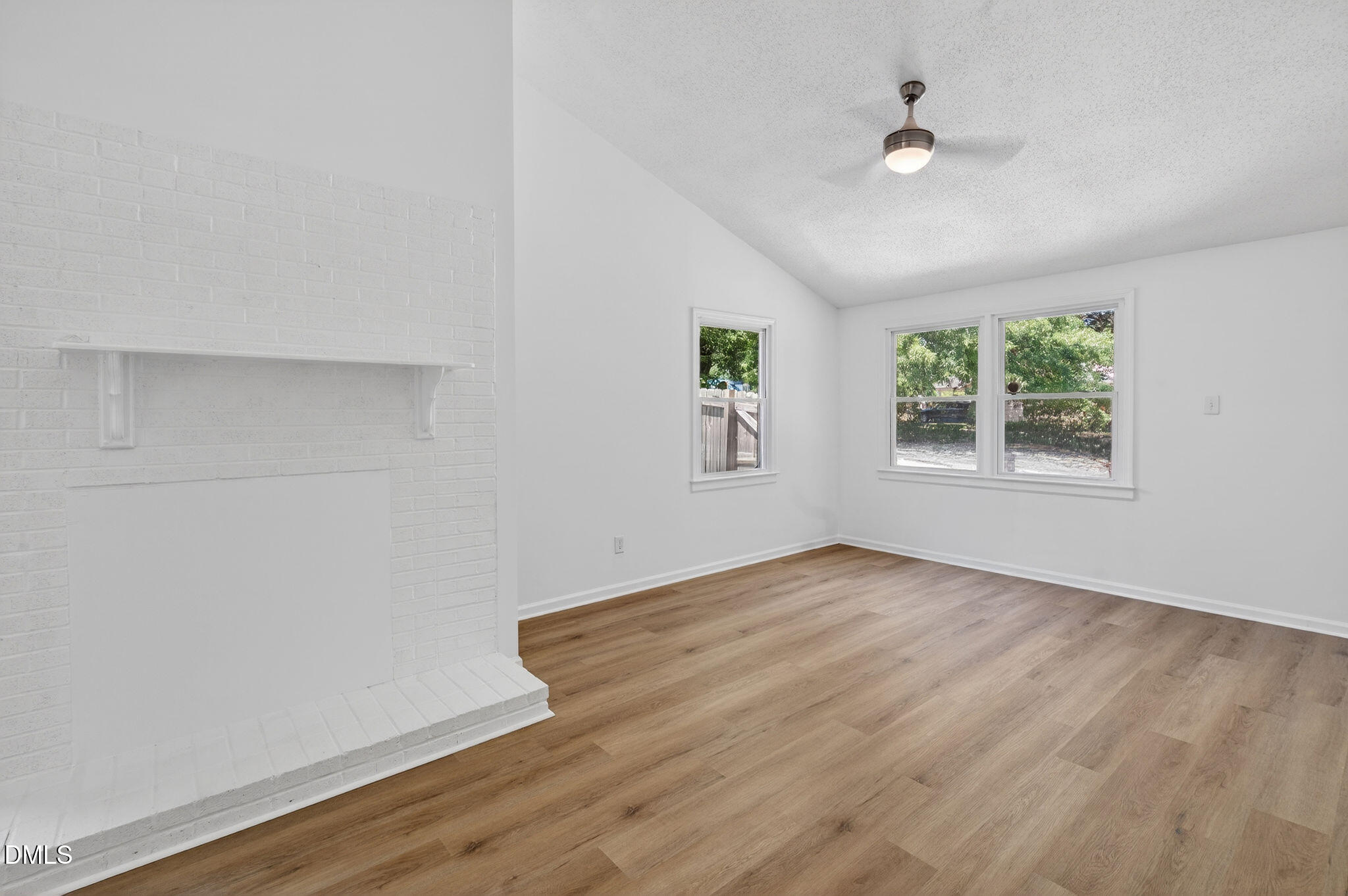 904 Seabrook Road Raleigh, NC 27610 - Photo 23 of 31 an empty room with windows and ceiling fan