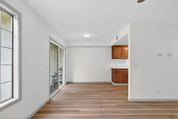 a view of a livingroom with wooden floor