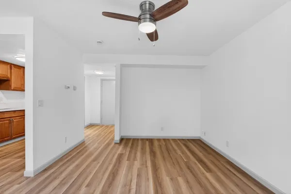 a view of room with wooden floor