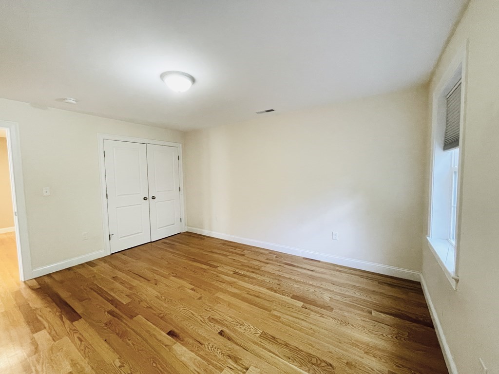 127 Lowell Street Lexington, MA 02420 - Photo 20 of 33 a view of empty room with wooden floor