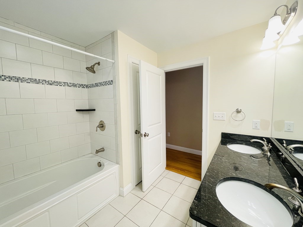 127 Lowell Street Lexington, MA 02420 - Photo 24 of 33 a bathroom with a sink a toilet and shower