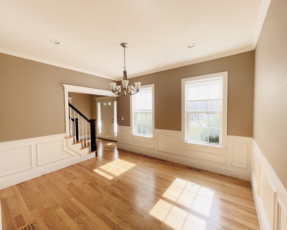 127 Lowell Street Lexington, MA 02420 - Photo 4 of 33 a view of an empty room with a window