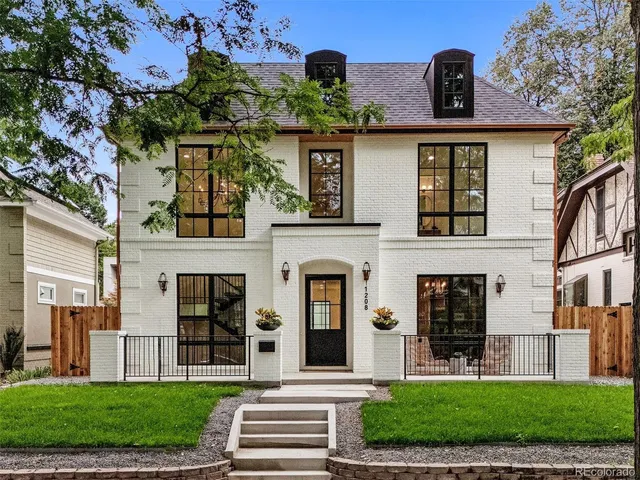 a living room with furniture kitchen and a table