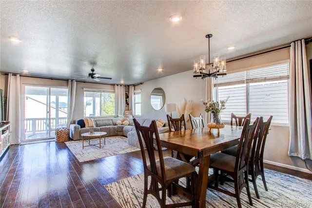 a view of a dining room with furniture window and wooden floor
