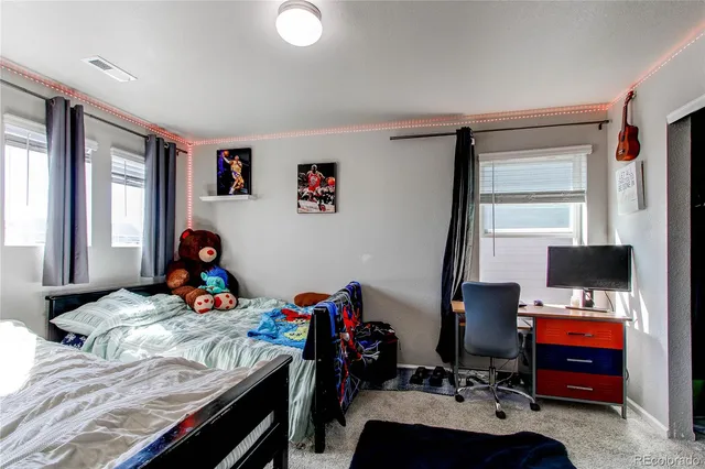 a bed room with a bed and a window