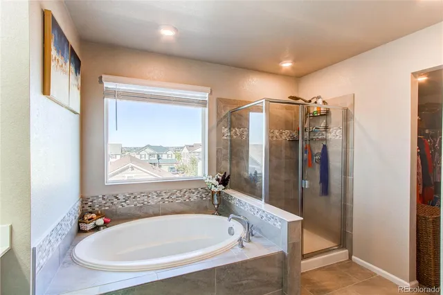 a bathroom with a tub and a sink