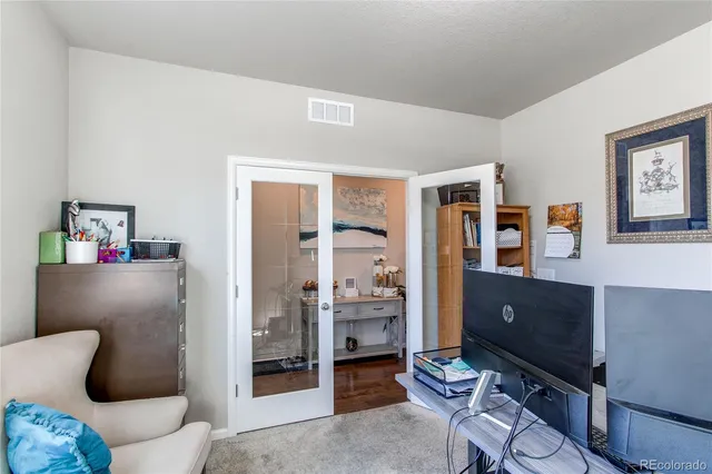 a living room with furniture and a table