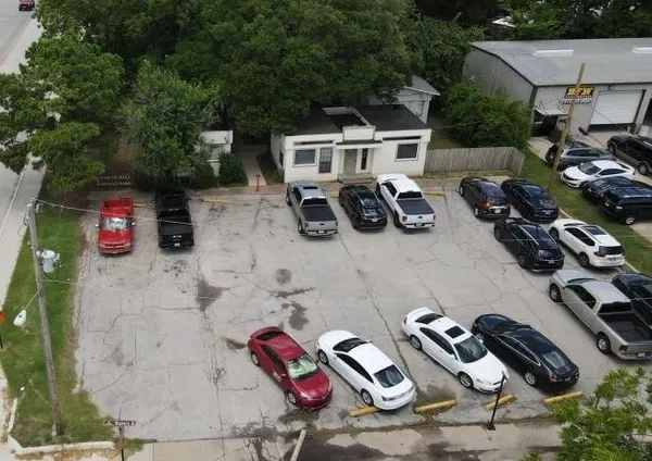 an aerial view of a house with garden space and street view