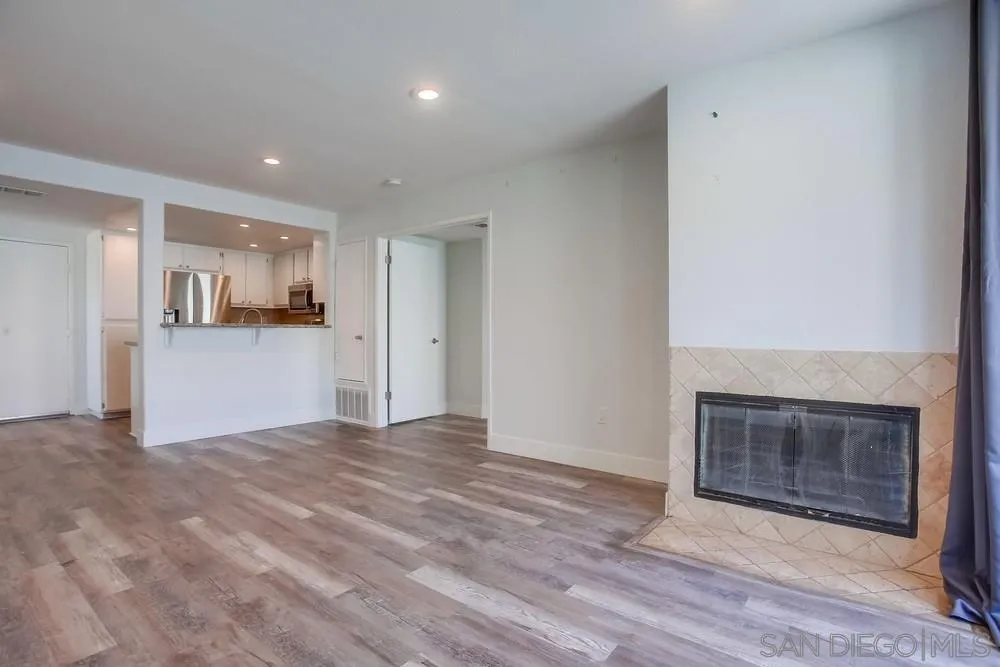 450 Stoney Point Way, Unit 135 Oceanside, CA 92058 - Photo 13 of 38 a view of a kitchen with a sink and a fireplace