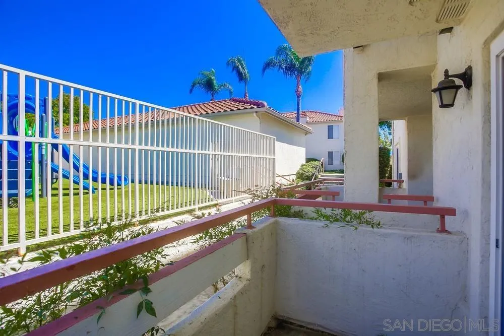 450 Stoney Point Way, Unit 135 Oceanside, CA 92058 - Photo 16 of 38 a view of balcony and wooden floor