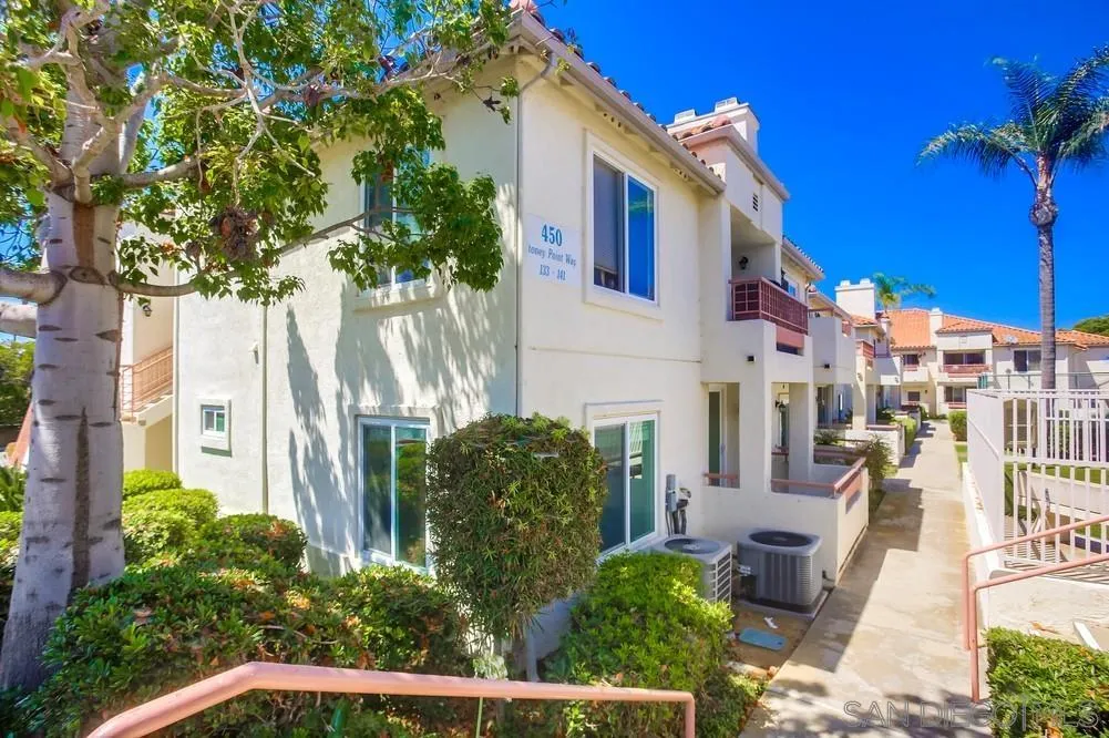 450 Stoney Point Way, Unit 135 Oceanside, CA 92058 - Photo 34 of 38 a front view of a house with a yard