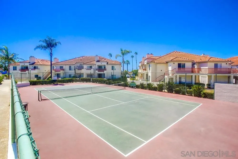 450 Stoney Point Way, Unit 135 Oceanside, CA 92058 - Photo 36 of 38 a view of a tennis ground with a large building in the background