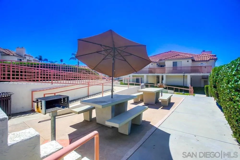 450 Stoney Point Way, Unit 135 Oceanside, CA 92058 - Photo 38 of 38 a patio with tables and chairs