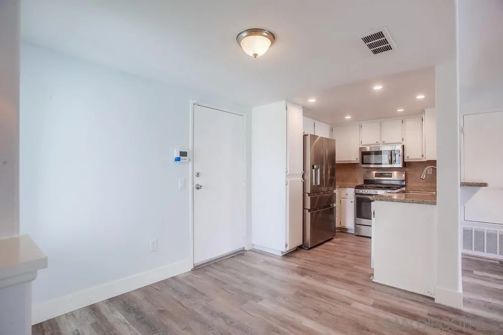 450 Stoney Point Way, Unit 135 Oceanside, CA 92058 - Photo 7 of 38 a view of kitchen with stainless steel appliances refrigerator oven and stove