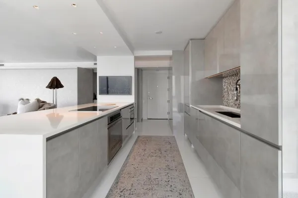 a view of a kitchen with a sink and windows