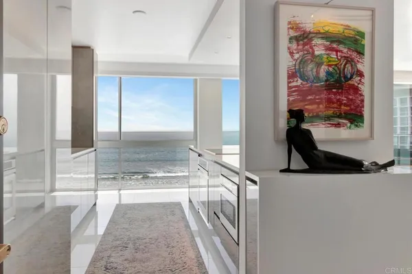a view of a kitchen with a sink and windows