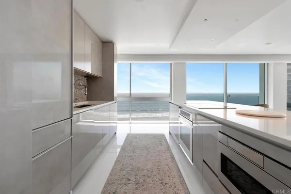 a view of kitchen island with a sink