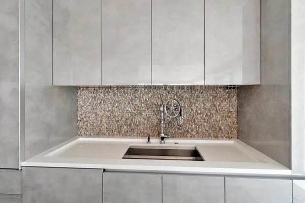 a view of a hallway with furniture and front door