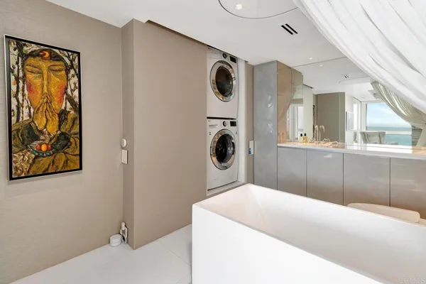 a bathroom with a sink mirror and vanity
