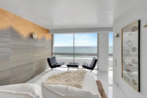 a room with a mirror and a wooden floor