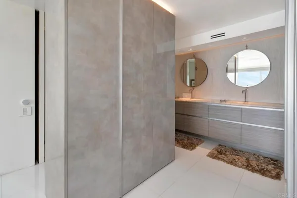 a front view of a building with a garden