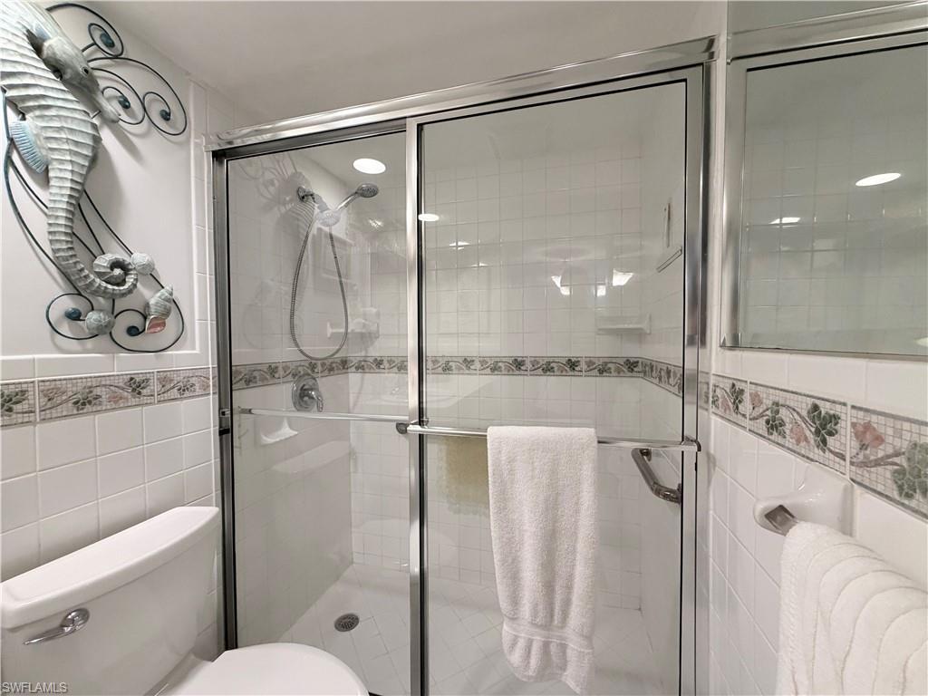 5800 Bonita Beach Road Southwest, Unit 2805 Bonita Springs, FL 34134 - Photo 15 of 30 Full bath with tile walls and a shower stall