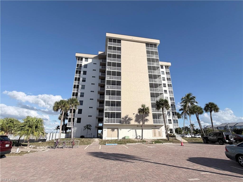 5800 Bonita Beach Road Southwest, Unit 2805 Bonita Springs, FL 34134 - Photo 17 of 30 View of apartment building / complex featuring uncovered parking
