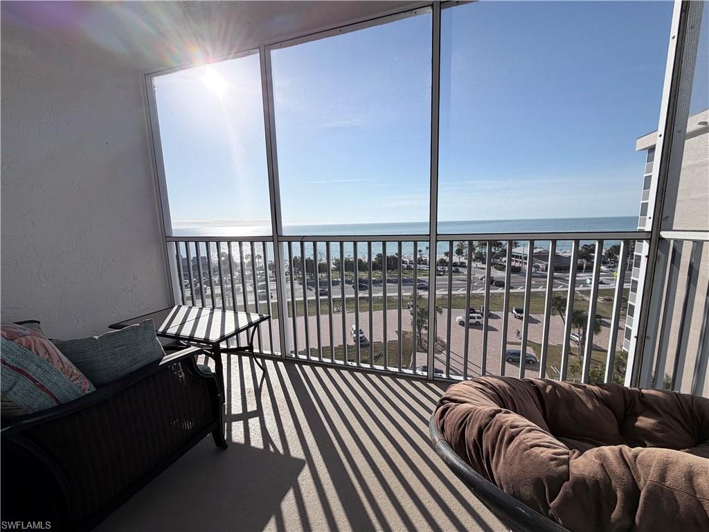 5800 Bonita Beach Road Southwest, Unit 2805 Bonita Springs, FL 34134 - Photo 20 of 30 Sunroom featuring plenty of natural light and a water view