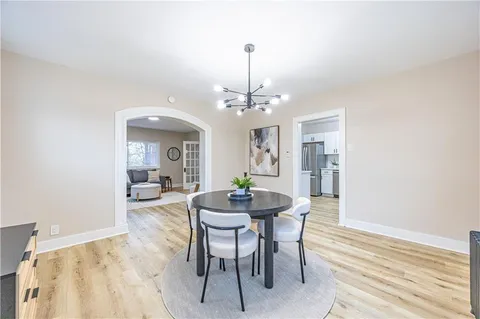 a dining room with a table and chairs