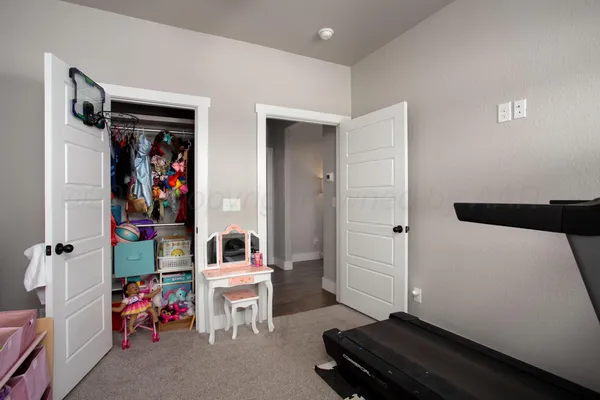 a room with furniture and white walls