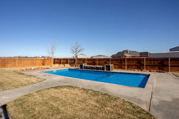 a view of a swimming pool with an ocean view