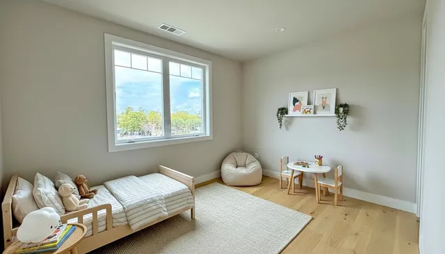 a bedroom with a bed and a window