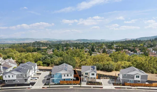 an aerial view of residential houses and city street