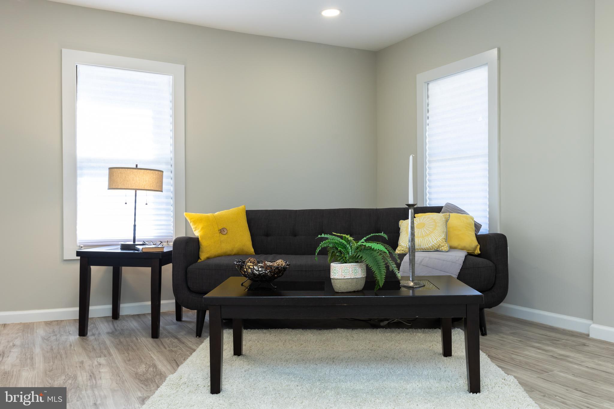 2407 Hammonds Ferry Road Halethorpe, MD 21227 - Photo 13 of 43 a living room with furniture and a window