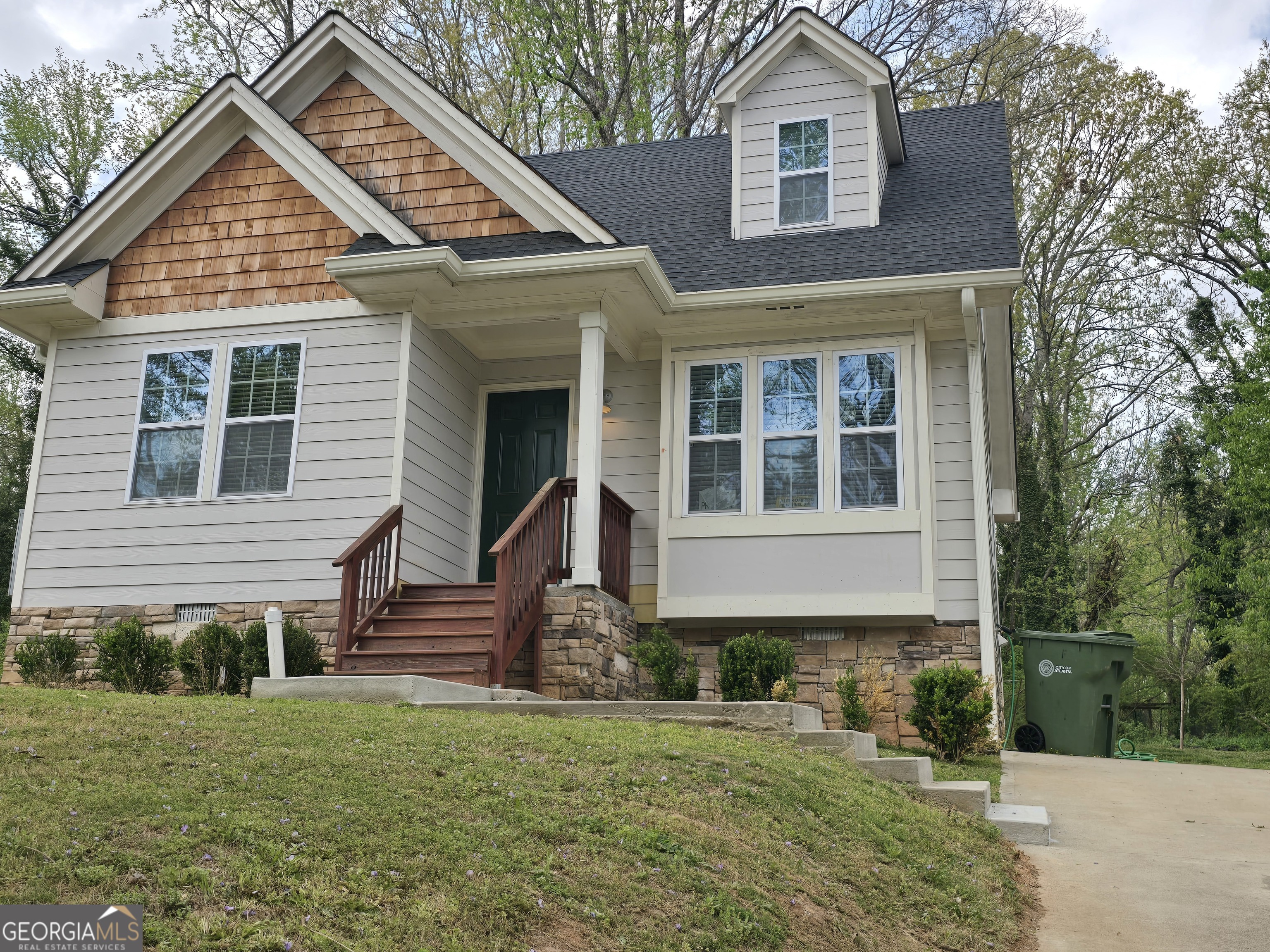 4075 Fairburn Avenue Southwest Atlanta, GA 30331 - Photo 1 of 12 a front view of a house with a yard