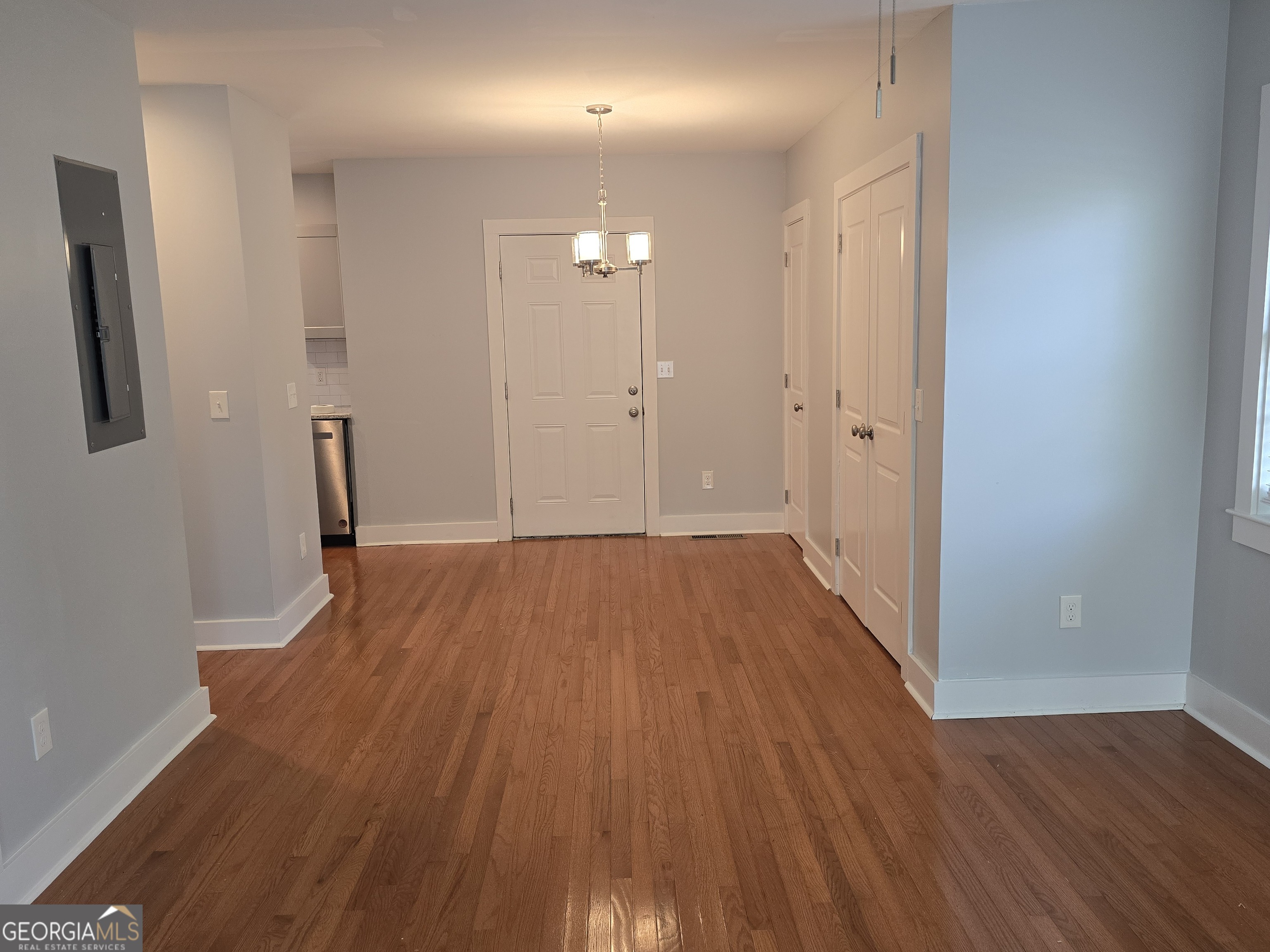 4075 Fairburn Avenue Southwest Atlanta, GA 30331 - Photo 3 of 12 a view of empty room with wooden floor and fan