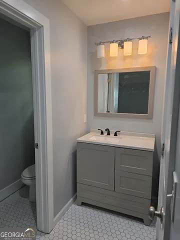 a bathroom with a sink and a toilet