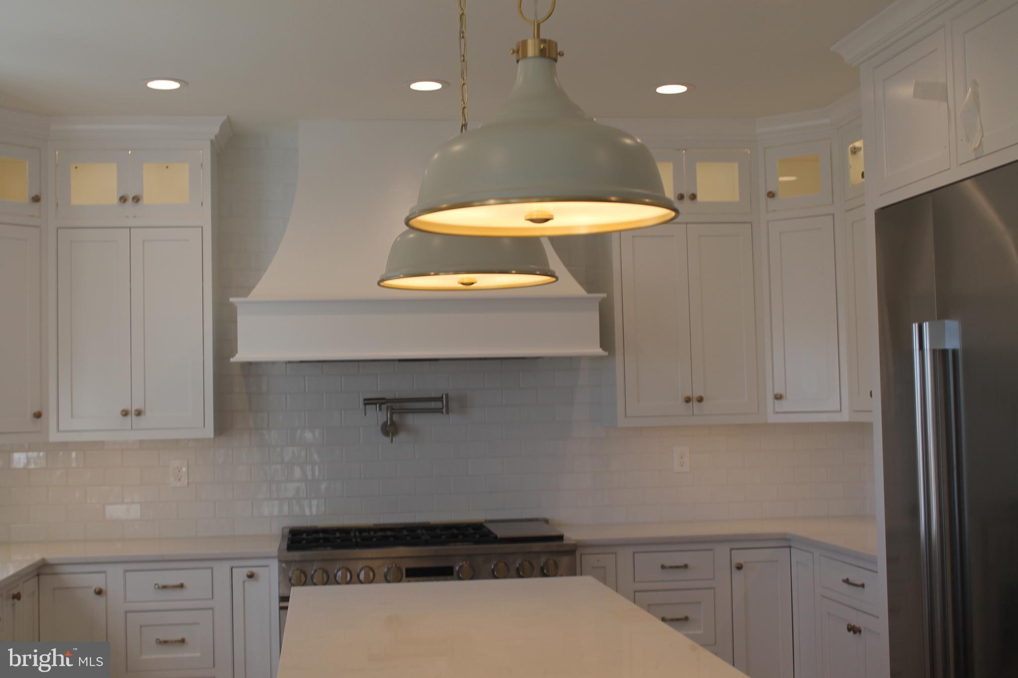 64 B Kirk Road Garnet Valley, PA 19060 - Photo 13 of 37 a kitchen with a refrigerator and a sink