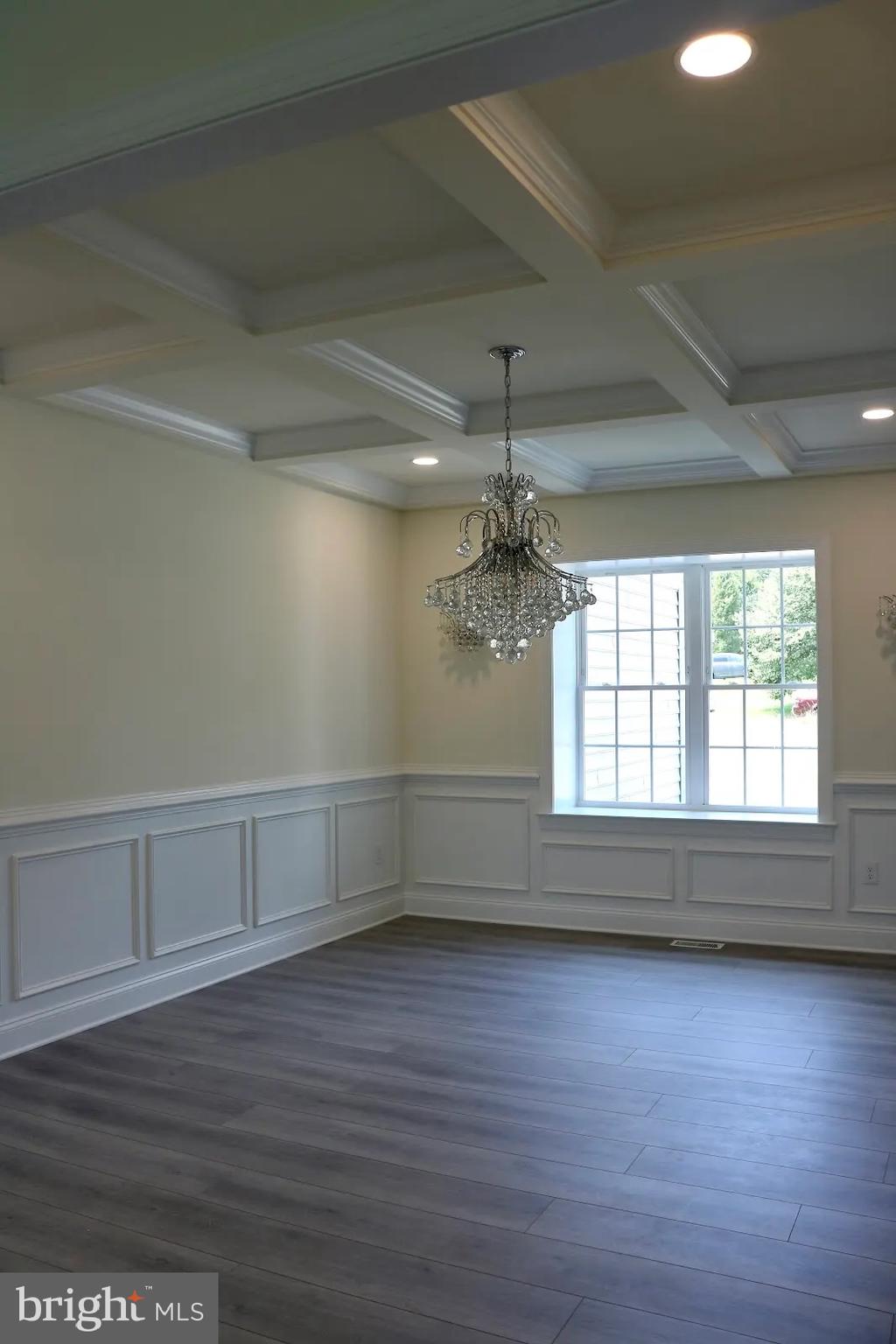 64 B Kirk Road Garnet Valley, PA 19060 - Photo 14 of 37 an empty room with wooden floor and windows