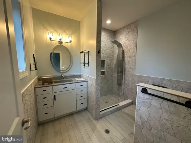 a white tub sitting next to a window