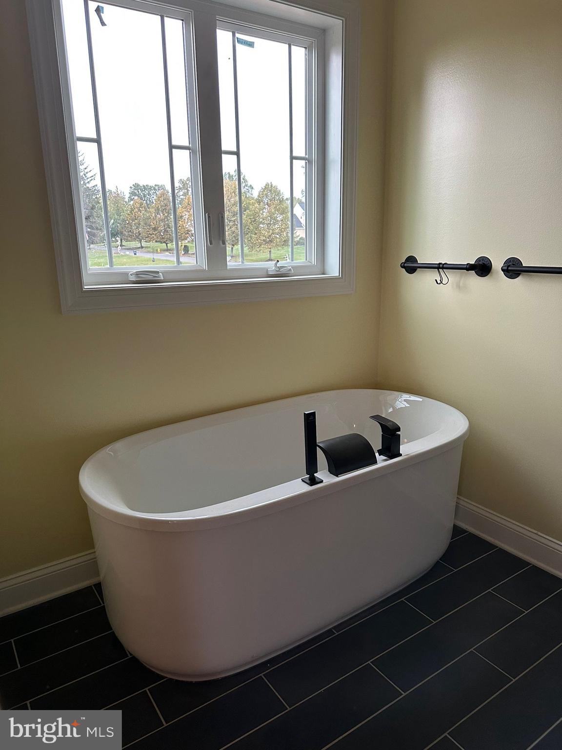 64 B Kirk Road Garnet Valley, PA 19060 - Photo 17 of 37 a white tub sitting next to a window