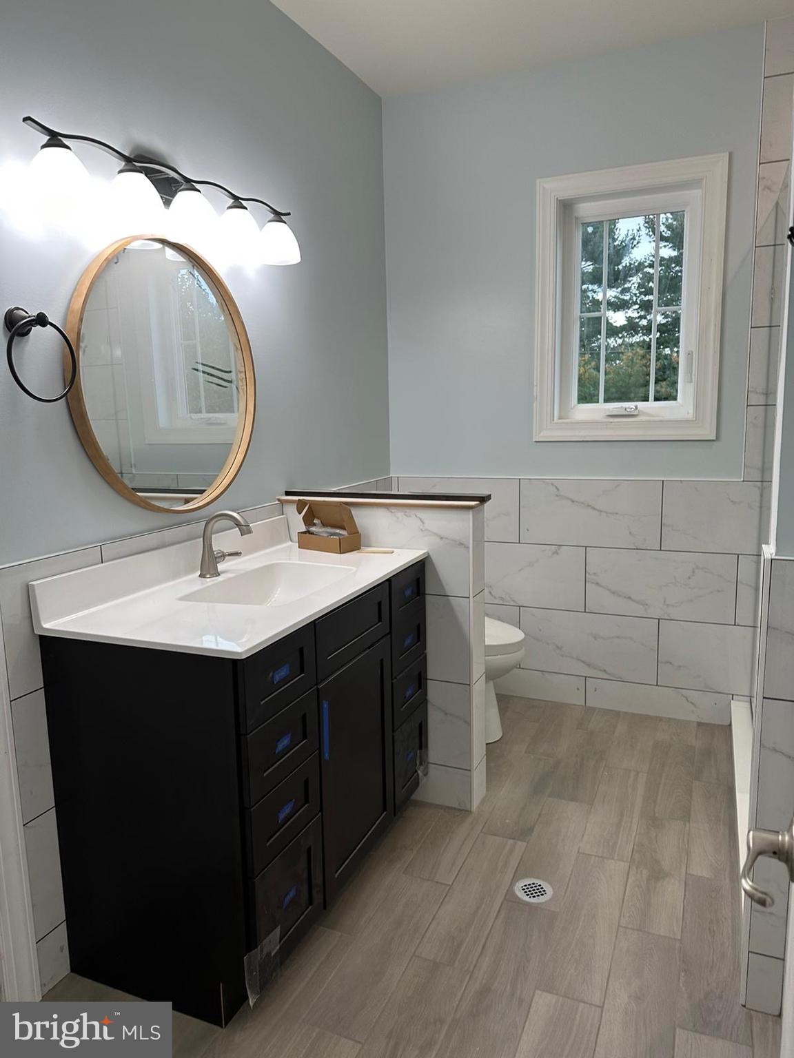 64 B Kirk Road Garnet Valley, PA 19060 - Photo 22 of 37 a bathroom with a sink vanity mirror and toilet